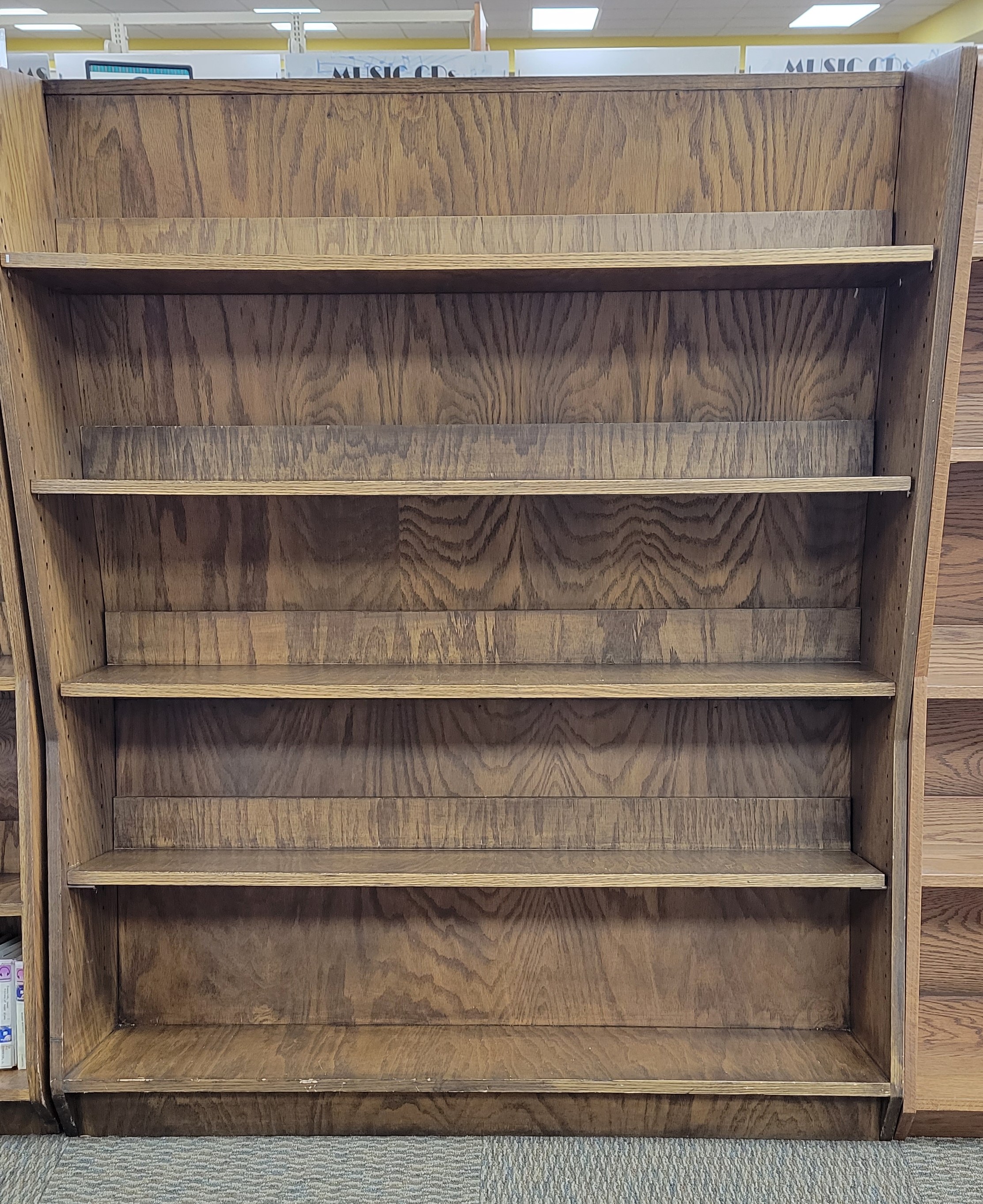 2 Double Sided Shelving Units Reaching Across Illinois Library System